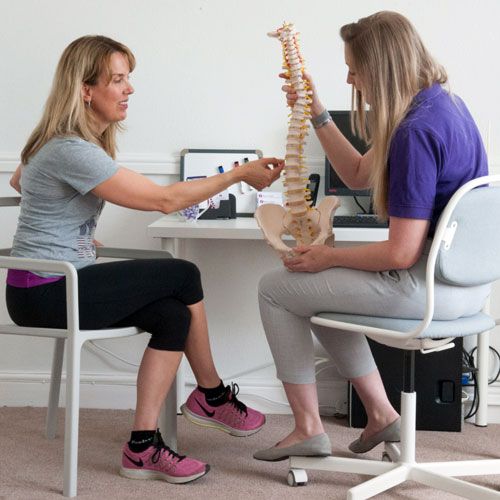 Patient speaking to Chiropractor in Chester