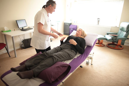 Client receiving acupuncture treatment in Chester