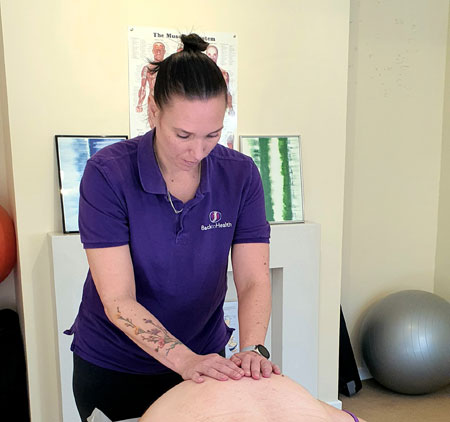 Client receiving massage therapy in Chester