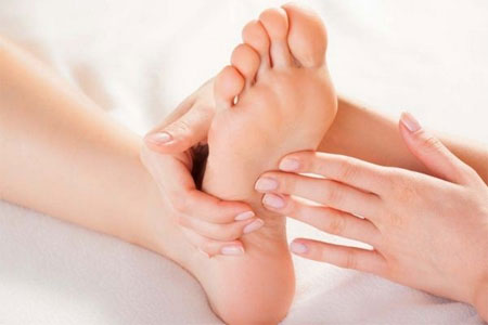 Client receiving foot reflexology in Chester